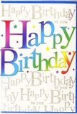 In this image, a striking birthday card stands propped open, its front design radiating colour and festivity that would feel perfectly at home on a decorated table in Wennington. The main focus is the phrase "Happy Birthday," written across the centre in generous, rounded letters that almost dance from one side of the card to the other. Each letter carries a flowing blend of colour - starting with saturated reds and pinks, sliding into cool blues and aquas, then into fresh greens and warm sunshine yellows - creating a smooth rainbow gradient that recalls party streamers fluttering in a gentle breeze. Behind this bold message, the entire background is softly patterned with repeated lines of gold script reading "Happy Birthday to you." The handwriting is delicate and looping, as if penned by hand, and appears to shimmer subtly, like the last glow of light over nearby fields at the edge of Wennington. The metallic script is fine enough that it doesn't compete with the main text; instead, it wraps the words in an elegant aura, adding depth and richness when the card catches the light. The surface looks sleek and faintly glossy, suggesting a premium finish that would feel smooth beneath your fingertips. Although the photograph focuses on the card alone, you can easily imagine it standing beside a bright birthday arrangement, its rainbow letters echoing the colours of fresh blooms delivered locally. The overall impression is one of pure, uncomplicated joy - a design that not only says "Happy Birthday" but also visually embodies the excitement and warmth of being celebrated by people who care.
